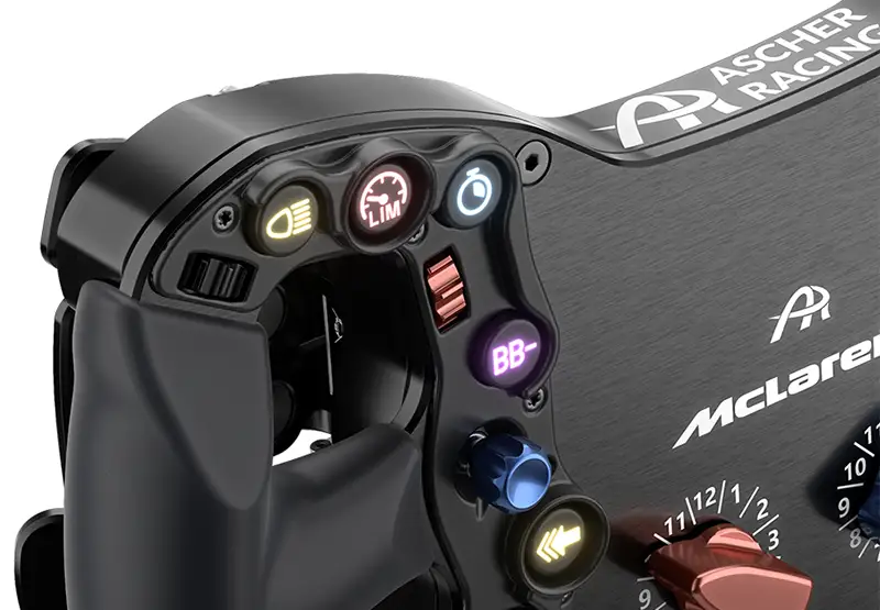Close up photo of the The Ascher Racing McLaren Artura Pro SIM wheel. It is black showing the black rubber grip and the brightly coloured dials and control lights